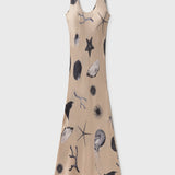 Beige dress with black sea-themed print on a white background