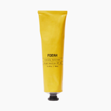 Yellow tube of FORAH sunscreen on a white background