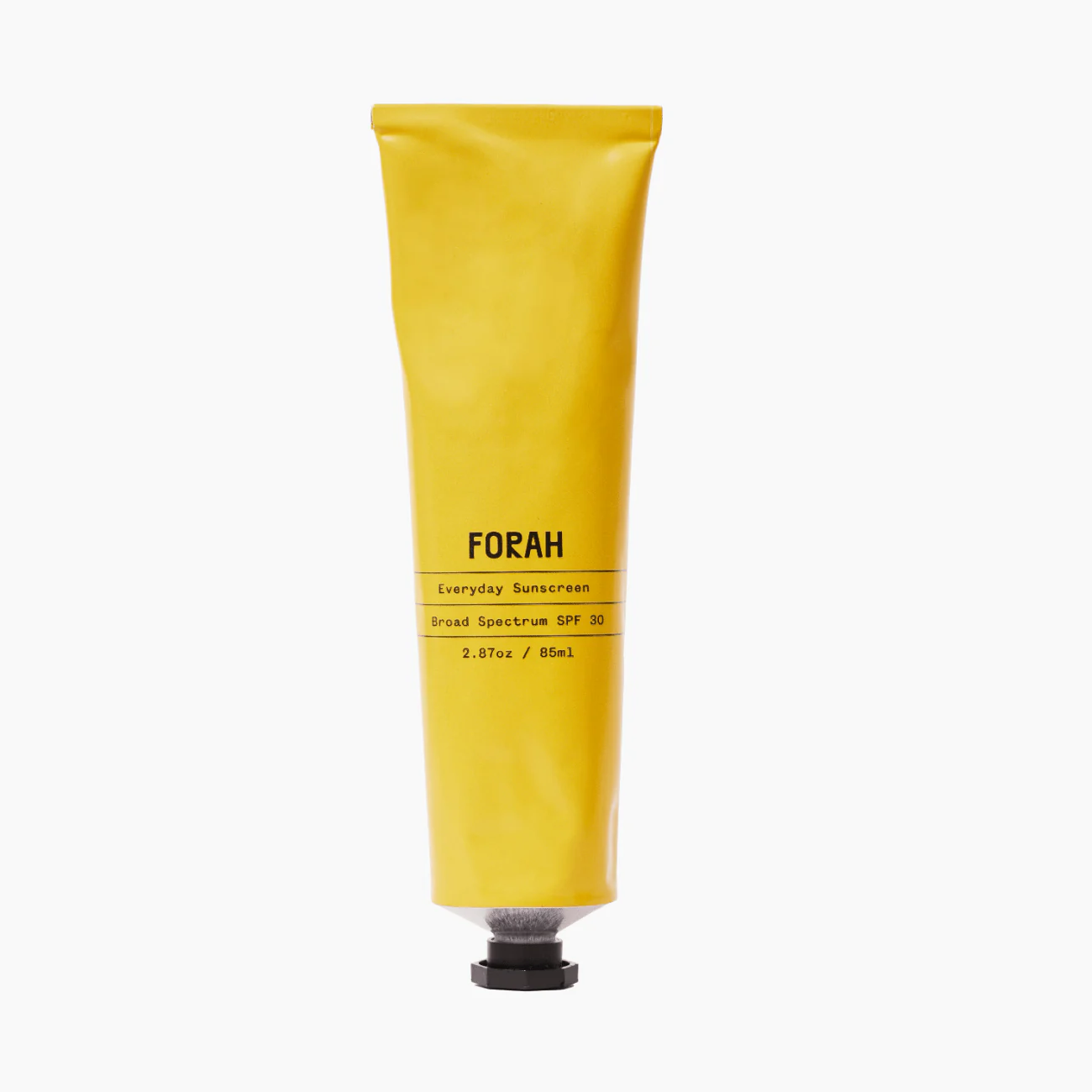 Yellow tube of FORAH sunscreen on a white background